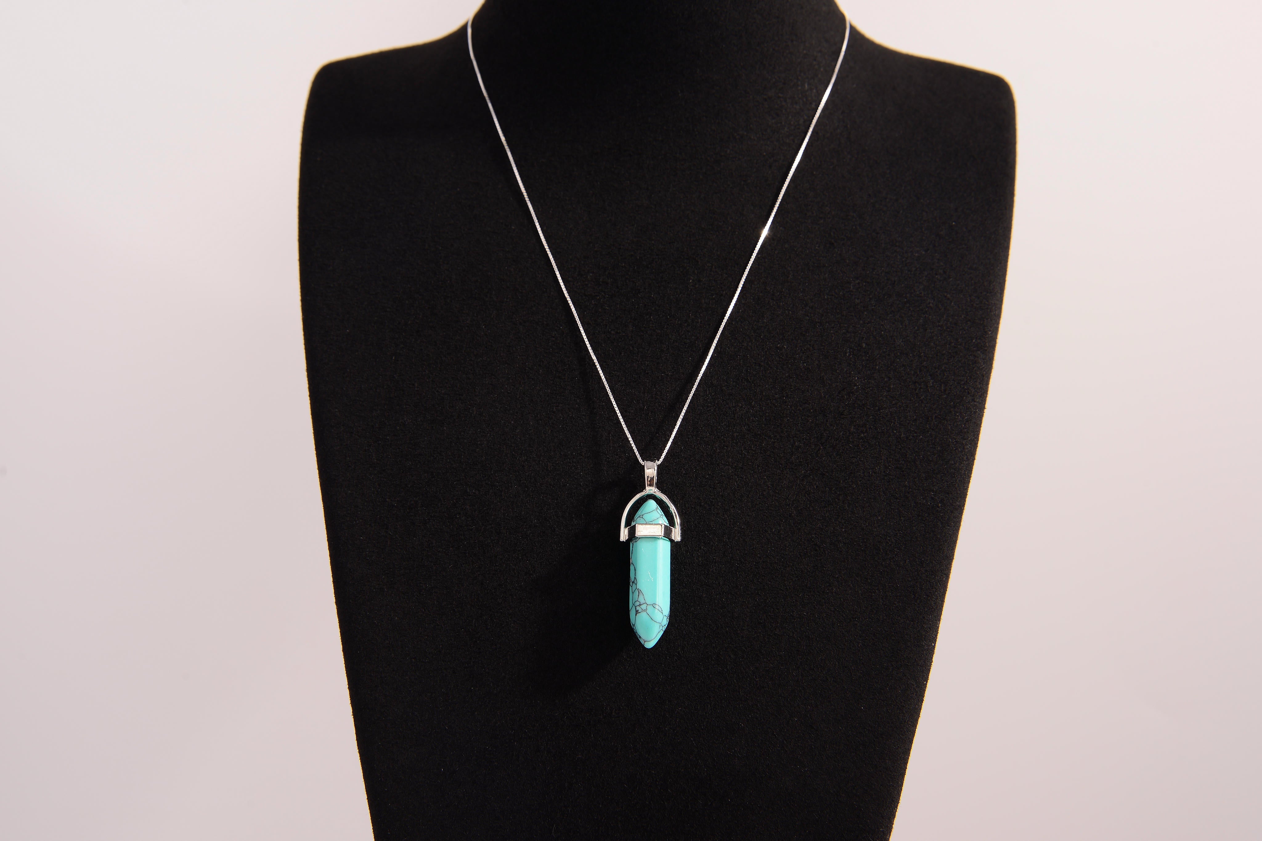 Raw Earth Crystals turquoise necklace featuring a pointed natural stone pendant, designed to promote communication, enhance intuition, and support emotional healing.
