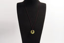 Raw Earth Crystals unakite donut pendant necklace, made from natural unakite to encourage emotional balance, compassion, and spiritual growth.
