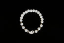 Raw Earth Crystals white jade bracelet with yin yang design, crafted from natural crystal, enhances clarity, peace, and emotional balance.