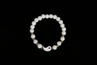 Raw Earth Crystals white jade bracelet with yin yang design, crafted from natural crystal, enhances clarity, peace, and emotional balance.