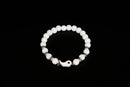 White jade beaded bracelet with yin yang charm from Raw Earth Crystals, featuring natural gemstones for balance, harmony, and spiritual alignment.