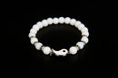 White jade beaded bracelet with yin yang charm from Raw Earth Crystals, featuring natural gemstones for balance, harmony, and spiritual alignment.