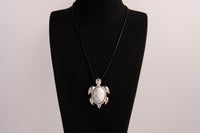 Raw Earth Crystals white turquoise turtle necklace crafted from natural stone to encourage calmness, clarity, and emotional healing.