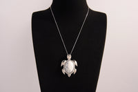 Raw Earth Crystals white turquoise turtle necklace crafted from natural stone to encourage calmness, clarity, and emotional healing.